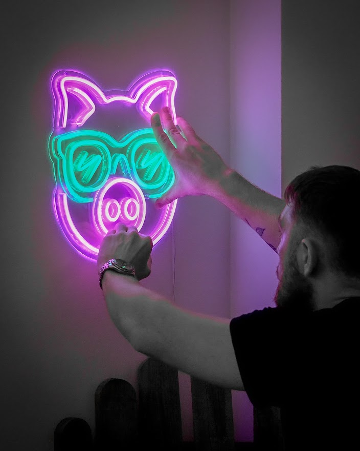 Don with Little Piggy Rentals neon sign